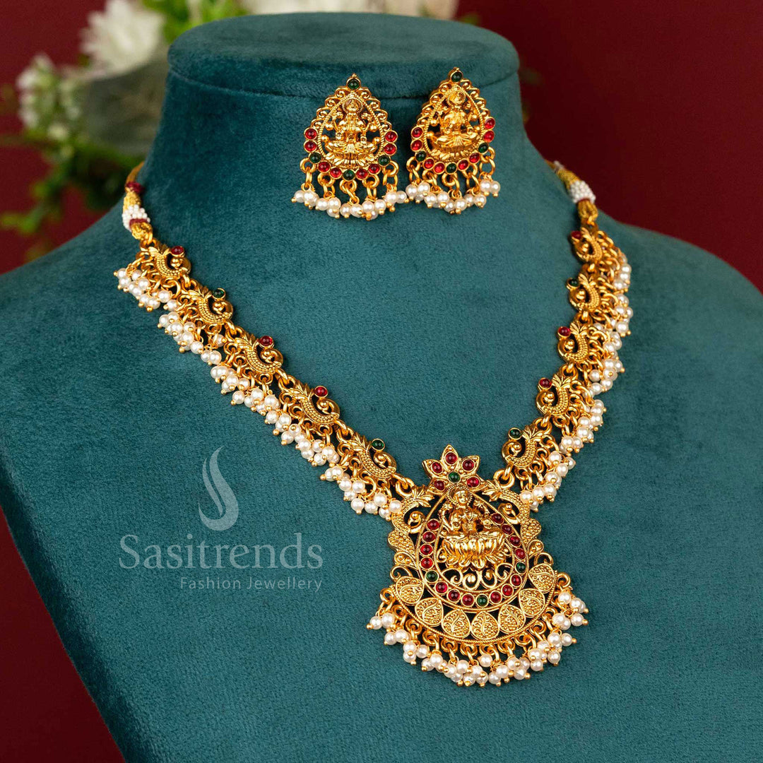 Regal matte gold-plated temple Lakshmi peacock necklace set, adorned with ruby-green embellishments - Sasitrends