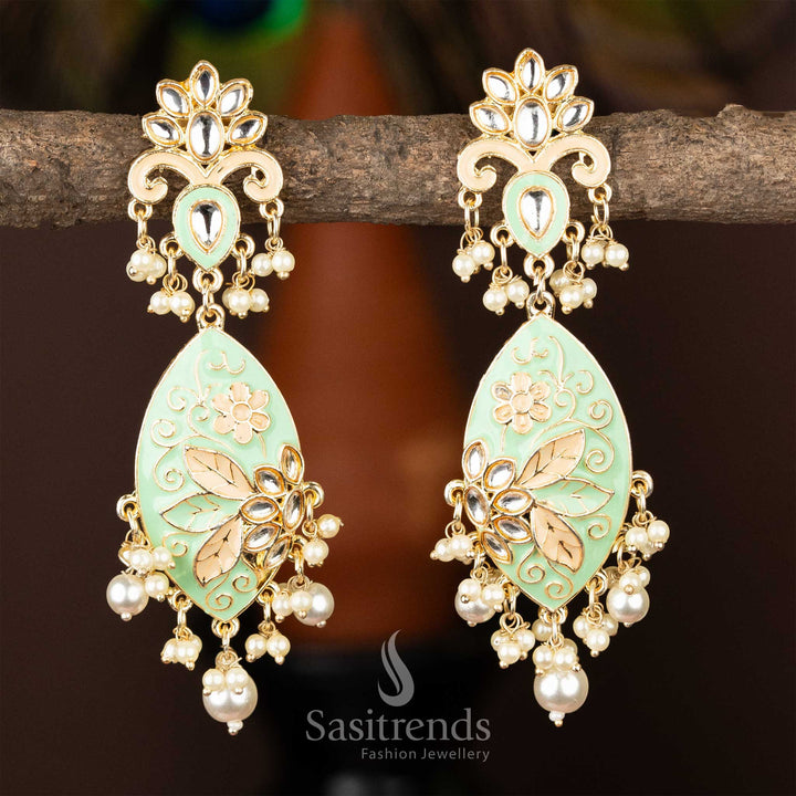 Gold-plated kundan earrings with light green enamel and cascading pearl accents.