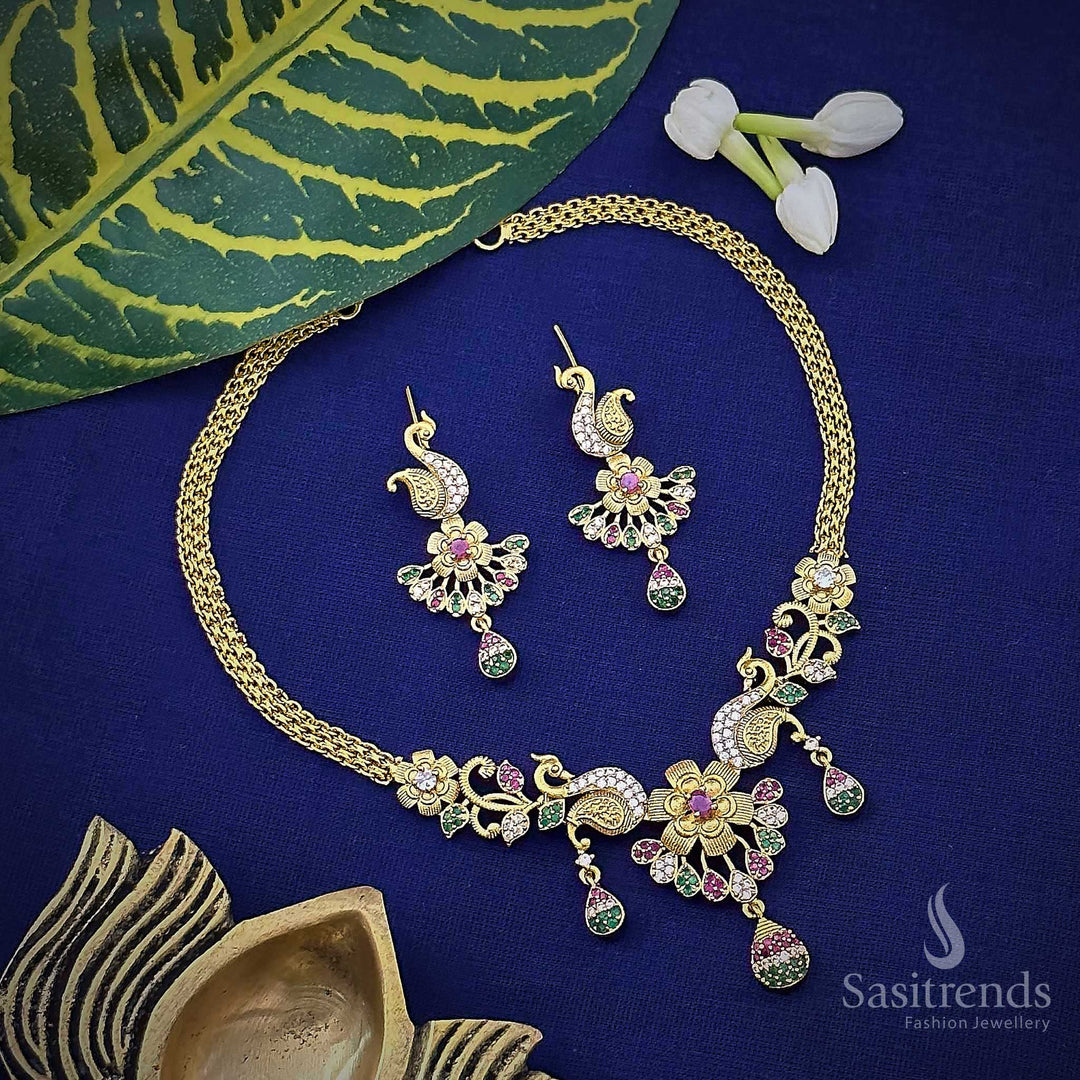 Traditional matte gold tone floral and peacock choker necklace with premium quality stones and earrings for women.
