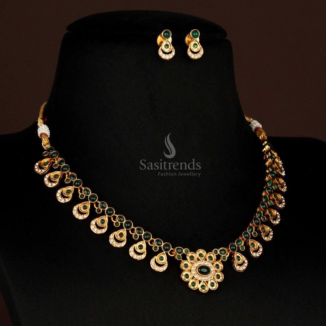 Graceful matte gold finish green floral design necklace set with oval pendant drops and matching earrings – classic temple-style jewellery for South Indian festivals – Sasitrends