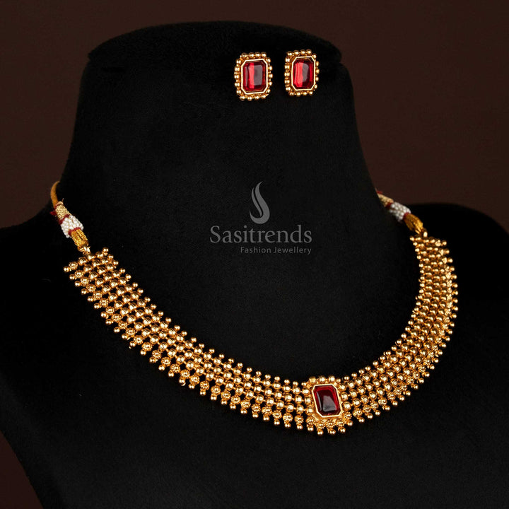 Opulent traditional matte gold necklace with rich ruby stone centrepiece and elegant ball chain styling – completed with stylish stud earrings for festive ethnic fashion – Sasitrends