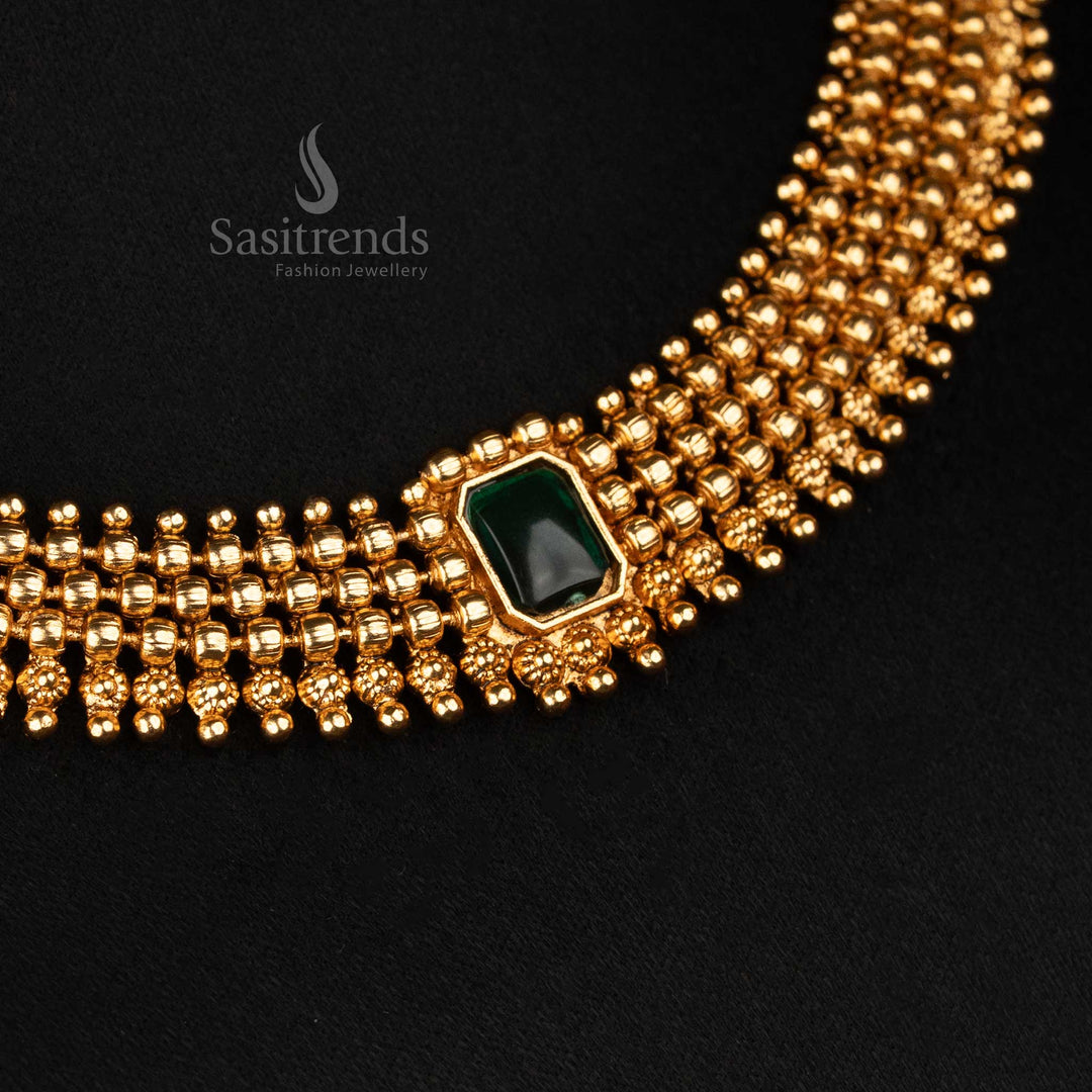 Antique-touch matte gold plated necklace with glossy green rectangle stone set on a fine ball chain, paired with minimal stud earrings – traditional jewellery evoking classical charm – Sasitrends