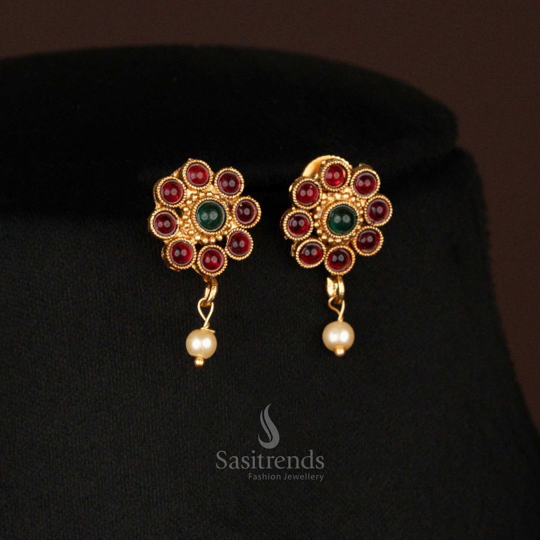Traditional matte gold pendant Earrings in ruby-green with floral round pattern and pearl hanging – ideal for wedding and pooja wear – Sasitrends