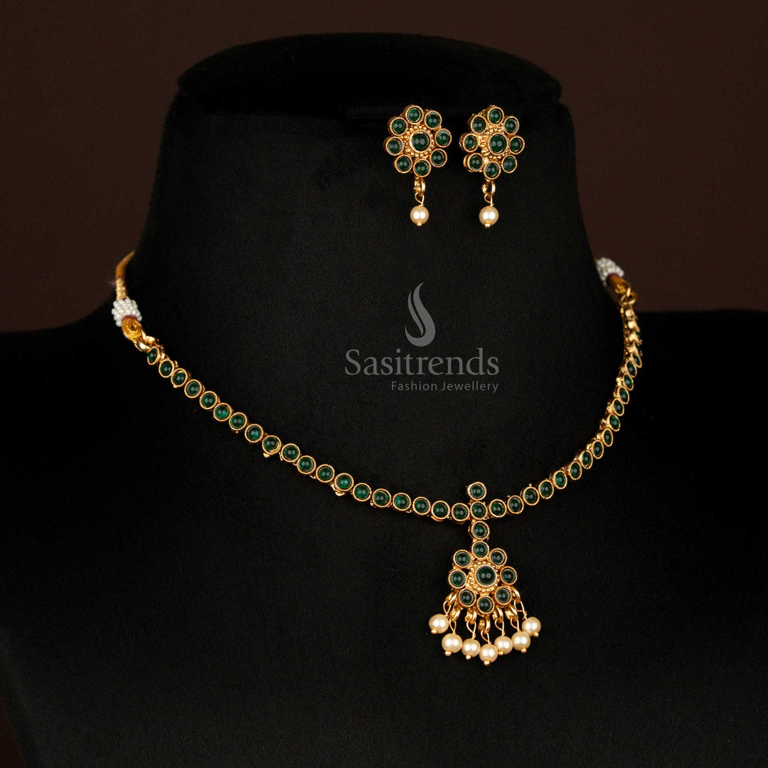 Temple-style matte gold necklace set with green floral round pendant and pearl hanging – a timeless choice for ceremonial bridal wear – Sasitrends