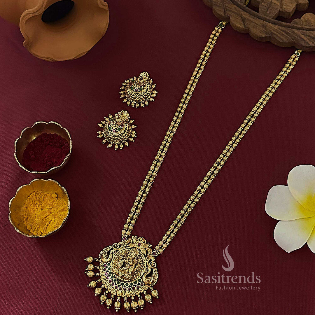Gorgeous bridal temple matte gold tone long haram jewellery set adorned with an exquisite Lakshmi pendant and classic traditional carvings, perfect for grand South Indian wedding wear – Sasitrends