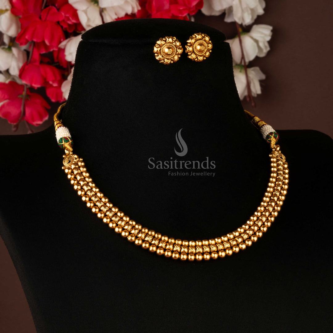 Traditional antique gold-plated jewellery set with floral and ball patterns, ideal for cultural events