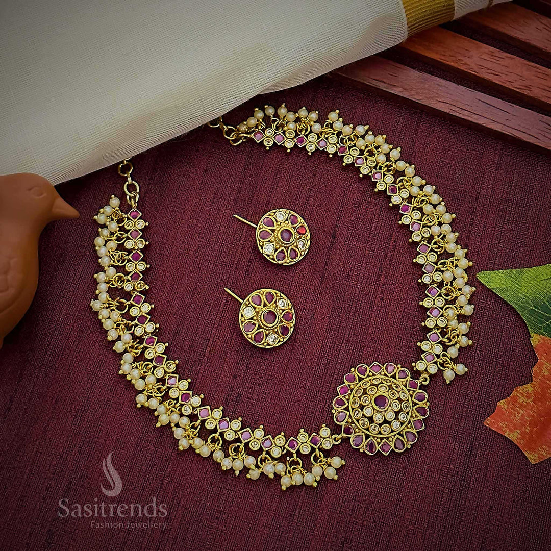 Elegant ruby-white choker jewellery set crafted with temple floral centrepiece, AD stone shimmer, and classic pearl highlights in matte gold finish – Sasitrends