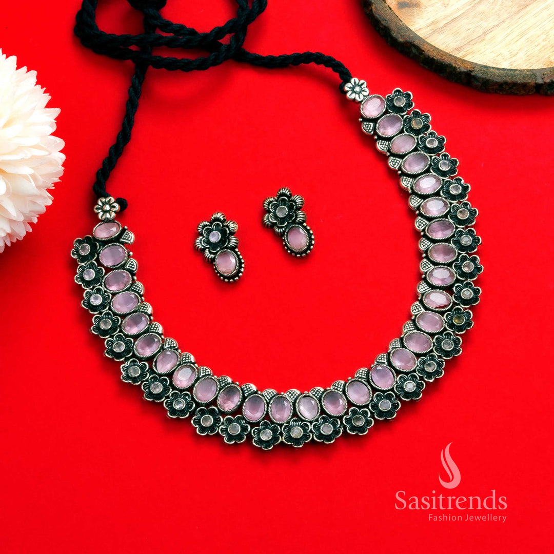 Majestic oxidised silver necklace set, designed with pink oval stones and floral earrings, creating a sophisticated traditional jewellery style - Sasitrends