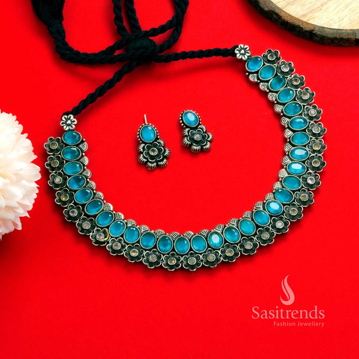 Elegant oxidised floral necklace set featuring mint oval-shaped stones and artistic earrings, offering an exquisite traditional jewellery touch - Sasitrends