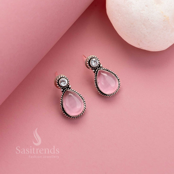 Charming pink Monalisa stud earrings in oxidised silver with dainty AD highlights – elegant jewellery for vibrant ethnic ensembles – Sasitrends