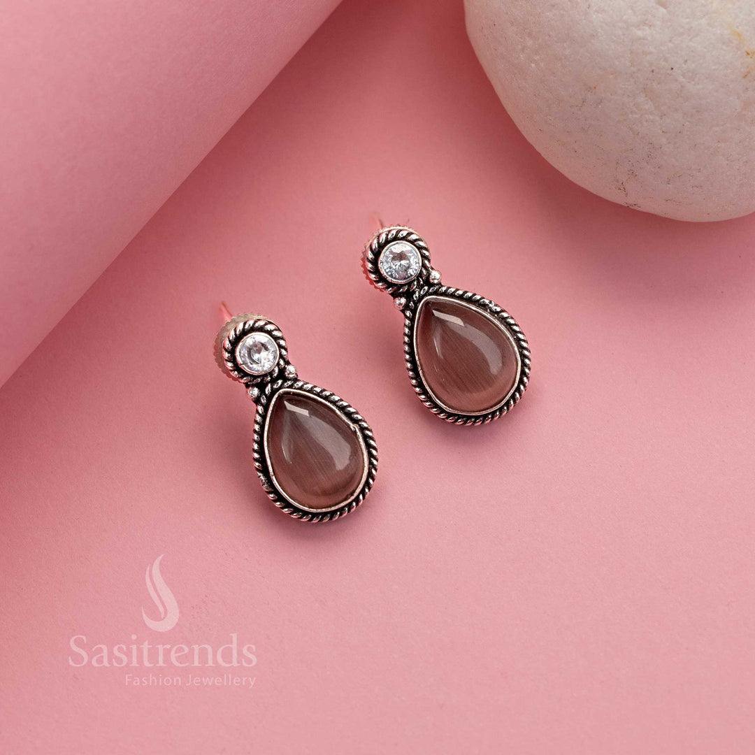 Delicate peach toned Monalisa oxidised silver studs with sparkling AD stone work – traditional jewellery for everyday elegance – Sasitrends