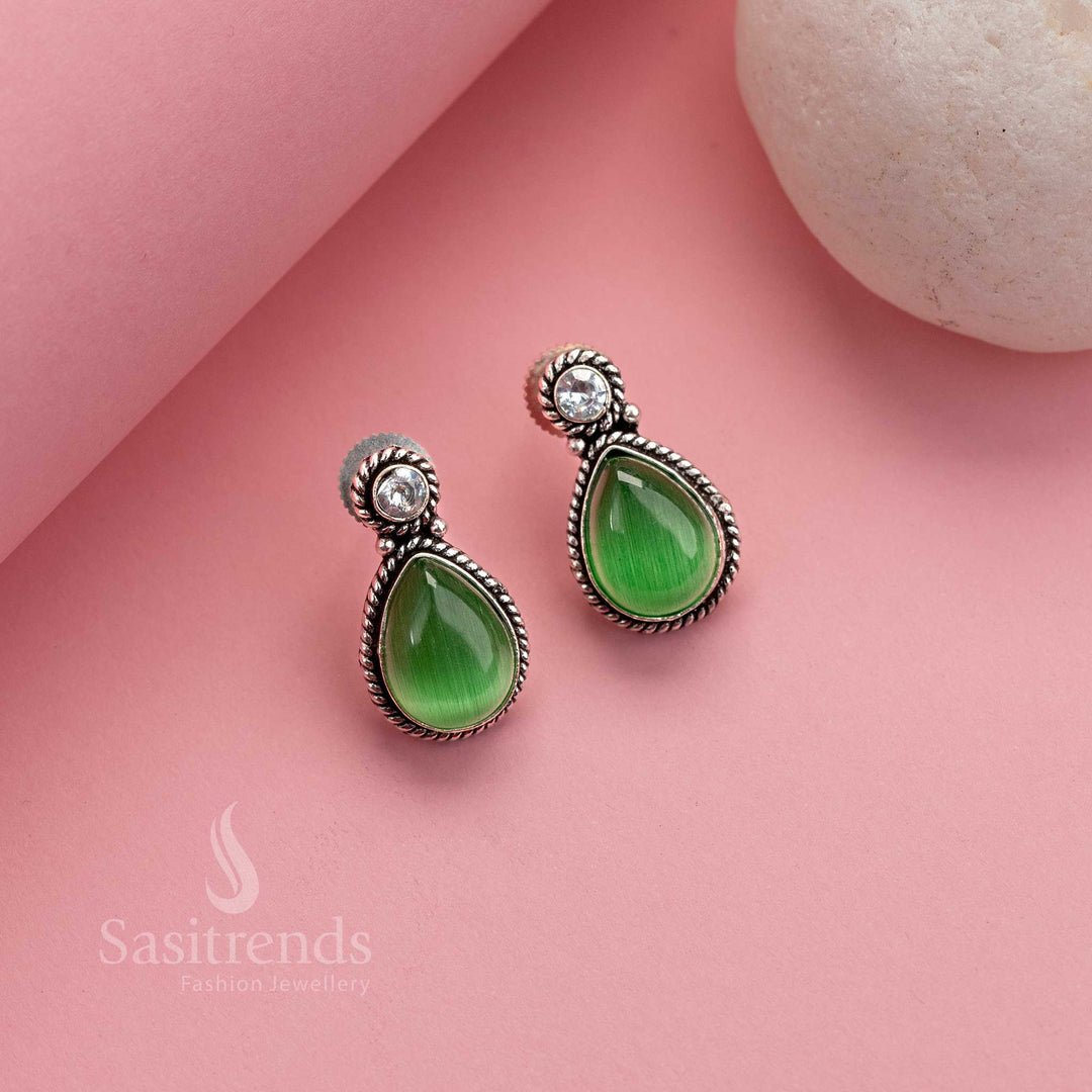 Elegant light green Monalisa oxidised silver studs with sparkling AD touches – graceful traditional jewellery for modern women – Sasitrends