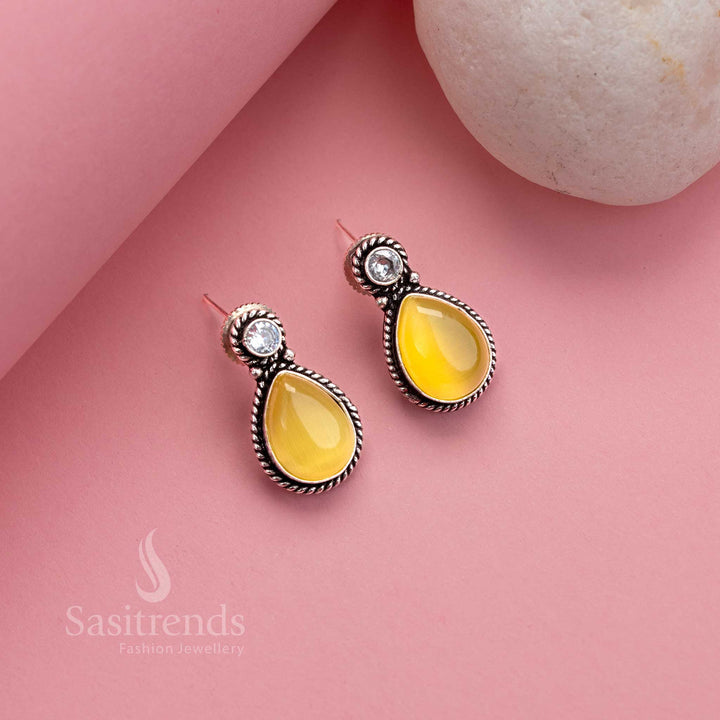 Bright yellow oxidised silver earrings with radiant Monalisa centre and AD twinkle – perfect accessory for professional charm – Sasitrends