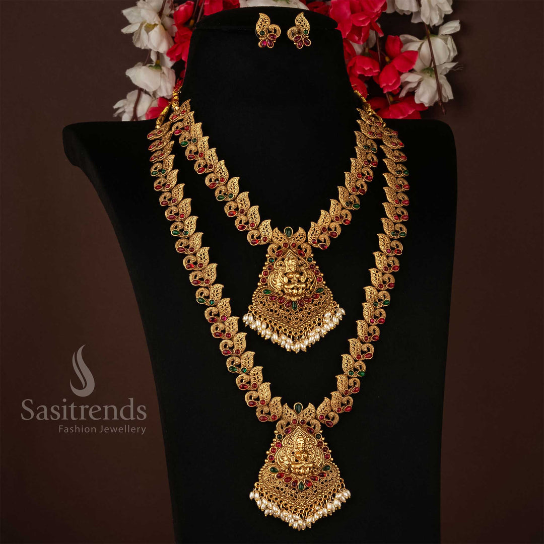 Classic temple-inspired matte gold plated combo necklace set featuring a divine Lakshmi motif centre pendant and intricately crafted peacock accents, a grand traditional jewellery ensemble ideal for bridal, festive, and ethnic celebrations – Sasitrends