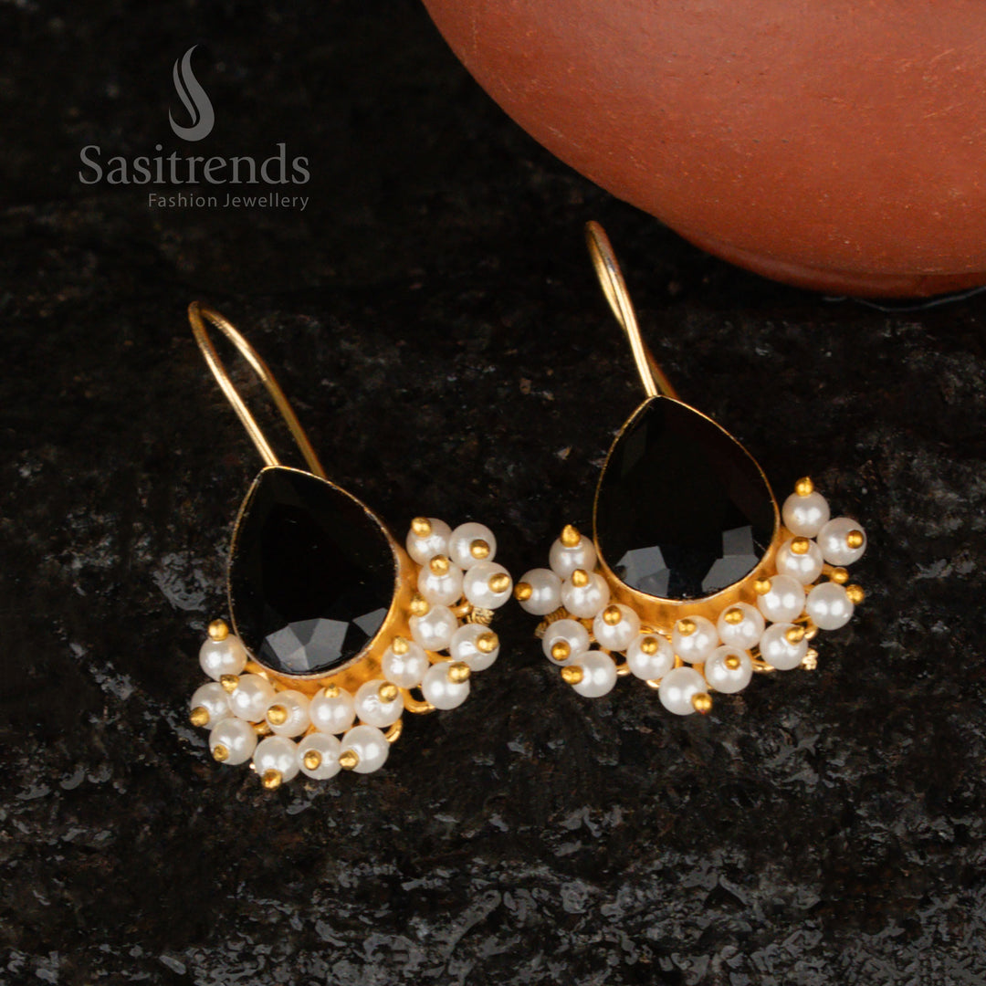 Mysterious jet-black Monalisa stone earrings in a pear-shaped gold-plated design, adorned with pearls for a striking look
