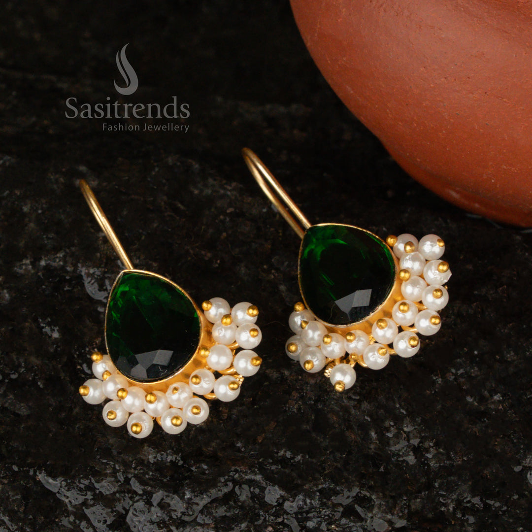 Majestic and opulent dark-green Monalisa stone earrings in a pear-shaped gold-plated design, enhanced with pearls for a luxurious finish