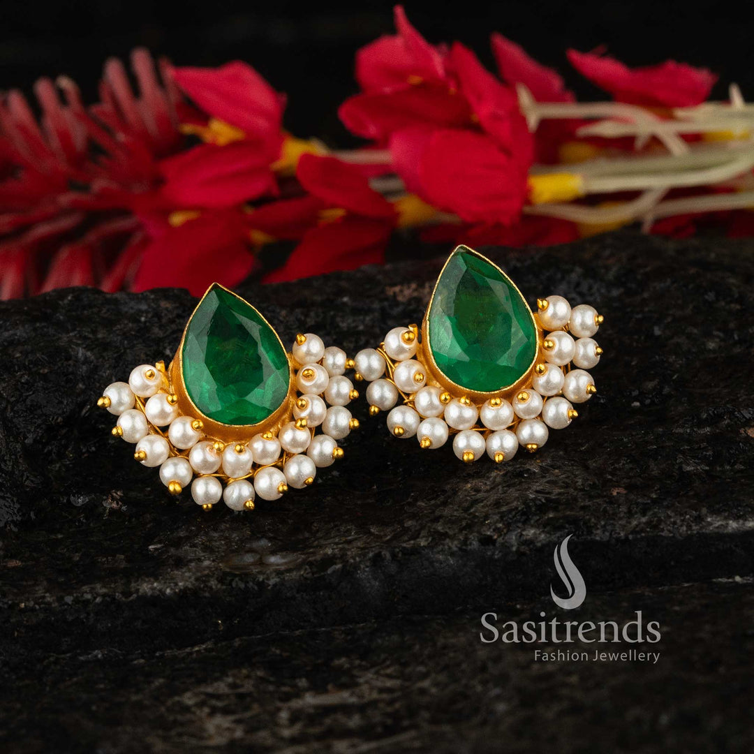 Radiant regalia inspired gold-tone waterdrop earrings featuring luminous Monalisa stones and subtle pearl accents – ornate finish makes them perfect for ethnic celebrations or elegant party wear jewellery – Sasitrends