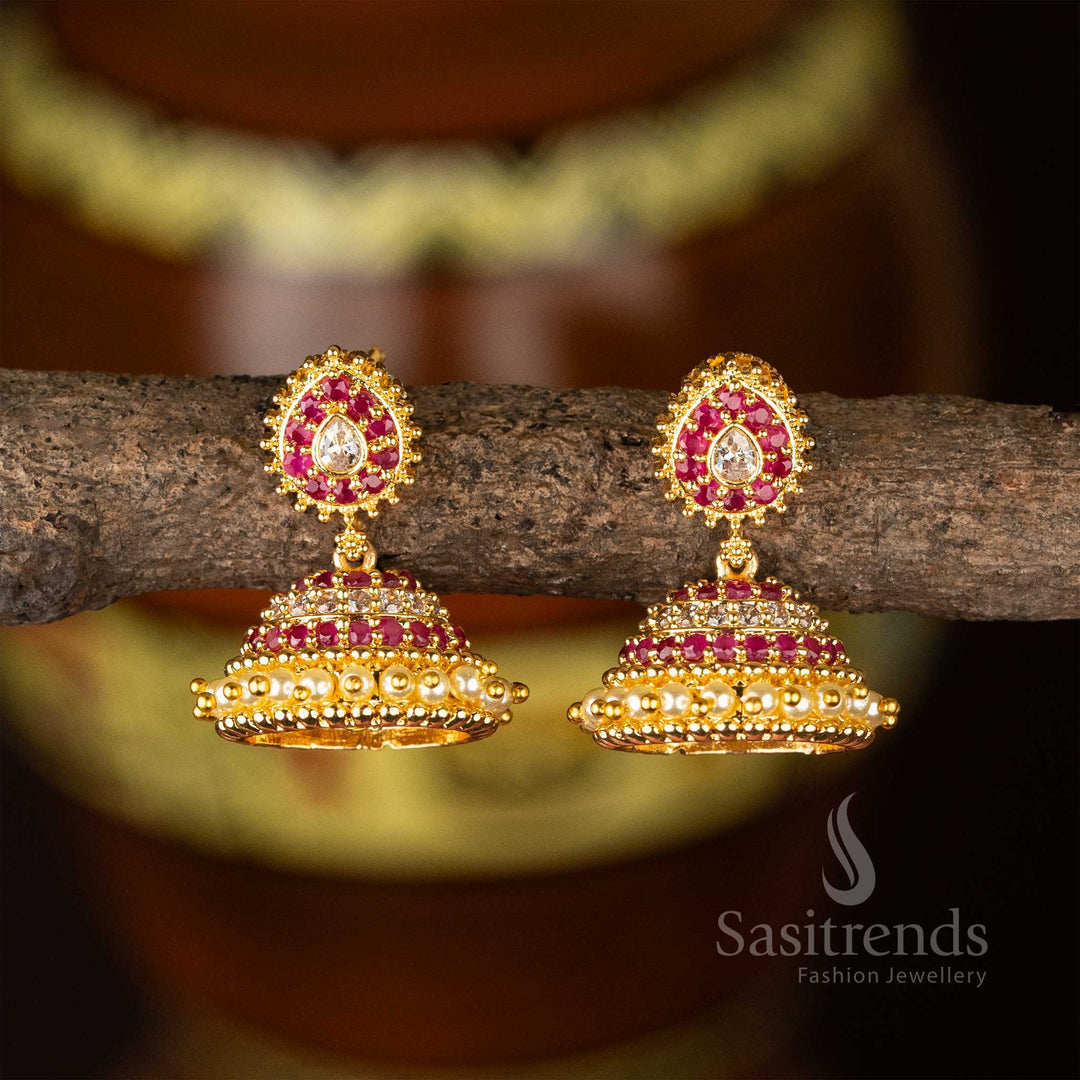 Ornate micro gold plated white-ruby jhumkas with vintage AD stone design and structured pearl drops – perfect for wedding function style – Sasitrends
