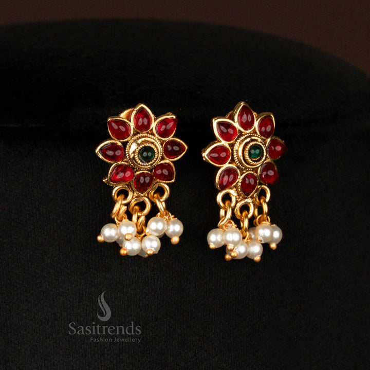 Grand heritage matte gold plated round floral pendant earrings set with earrings featuring ruby-green stones, pearl danglers, and traditional beaded motifs – divine temple jewellery elegance for festive occasions – Sasitrends