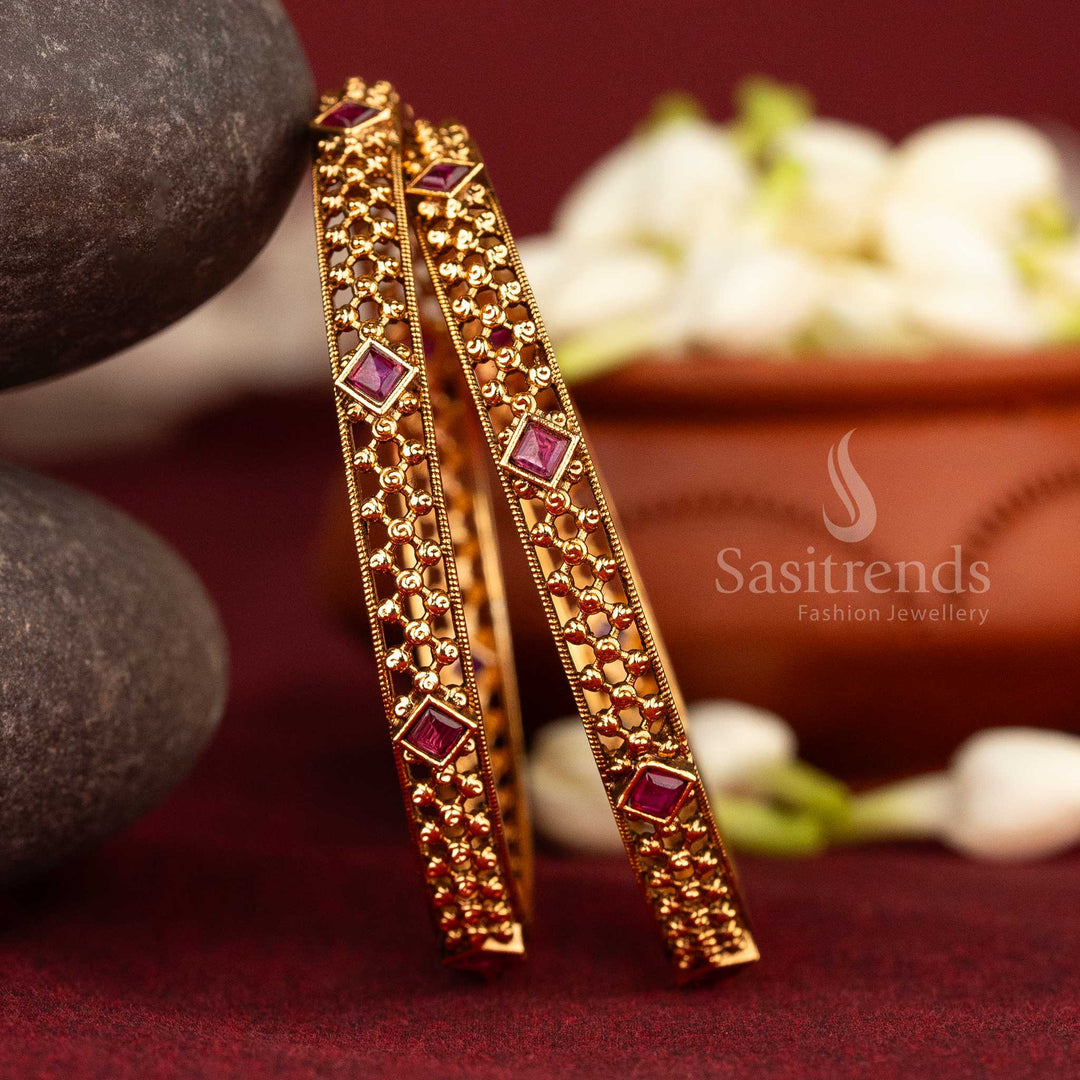 Ruby antique matte gold bangles with detailed beadwork and Kemp stones