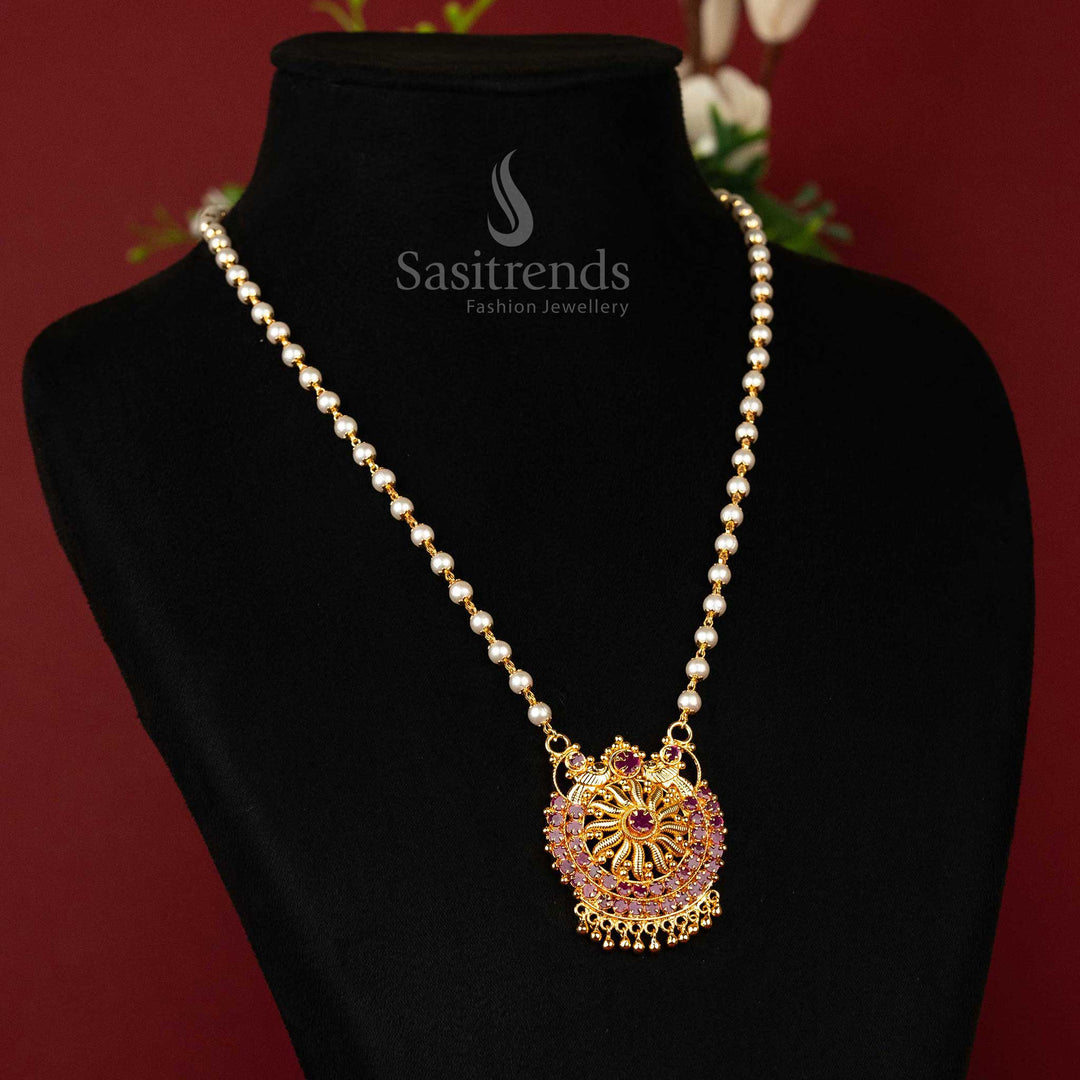 Stunning ruby pendant necklace with gleaming AD accents, paired with layered pearl mala and a rich gold finish for traditional occasions – Sasitrends