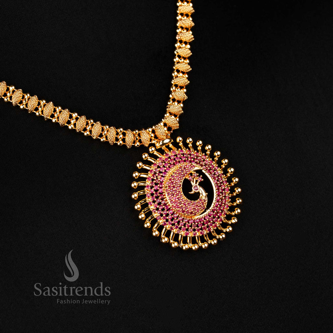 Regal ruby American diamond studded peacock pendant necklace in one gram micro gold finish – a perfect blend of heritage design and ethnic jewellery styling by Sasitrends