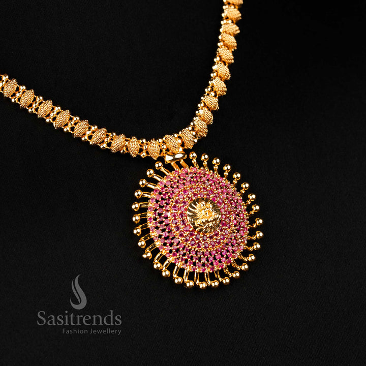 Richly designed micro gold-plated Lakshmi sunburst pendant necklace with vibrant ruby stones, embodying traditional grace and festive charm – premium one gram jewellery artistry by Sasitrends