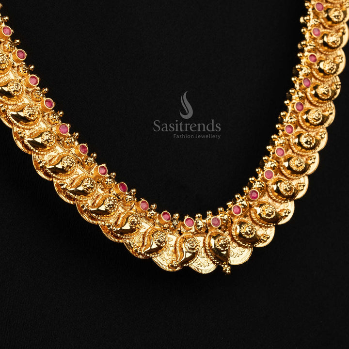 Radiant paisley coin-inspired gold-plated long necklace featuring vibrant ruby stones, perfect for enhancing traditional saree styles - Sasitrends