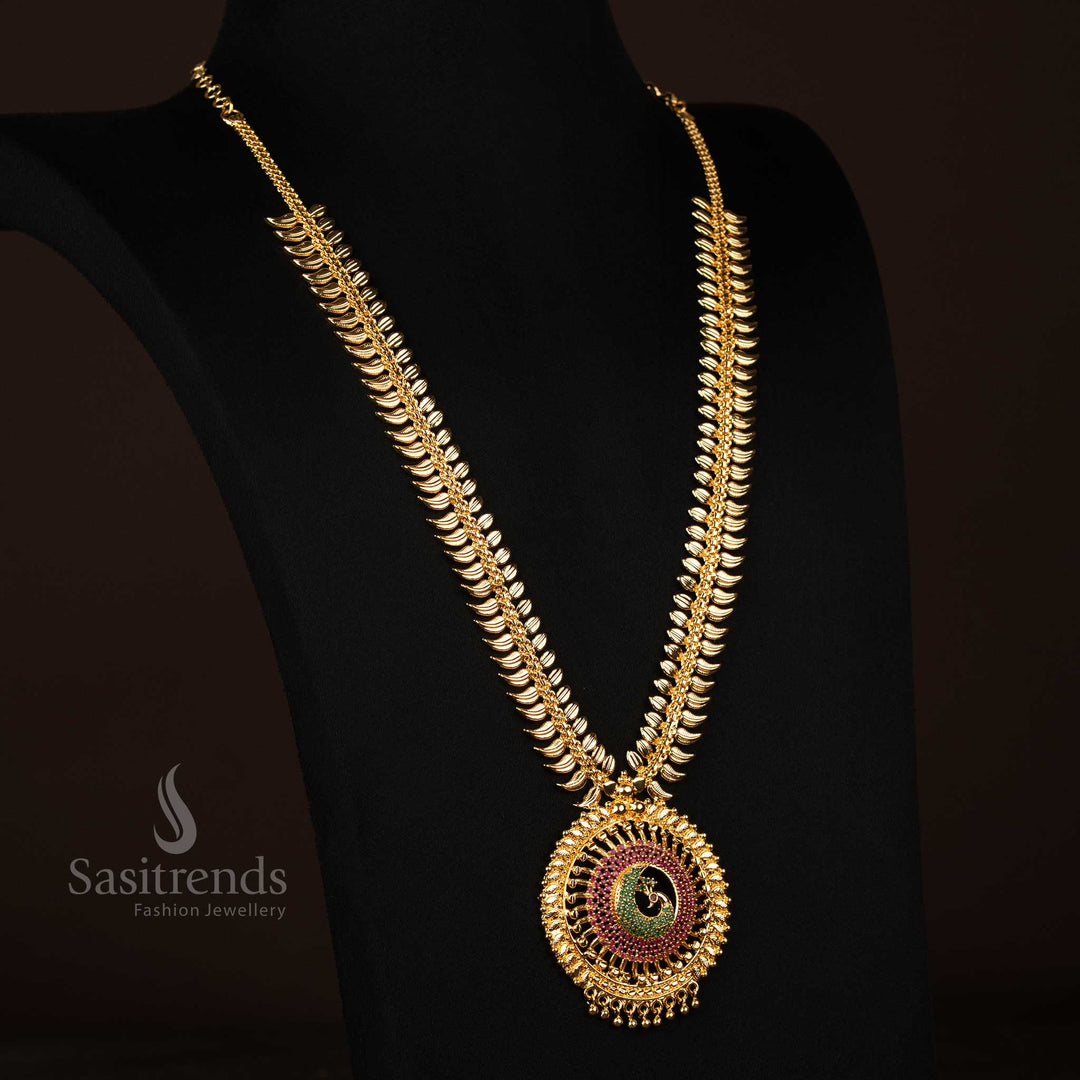 Ruby-green leaf-patterned long necklace with grand peacock centrepiece, finished in brilliant micro gold tone – Temple jewellery with divine opulence – Sasitrends