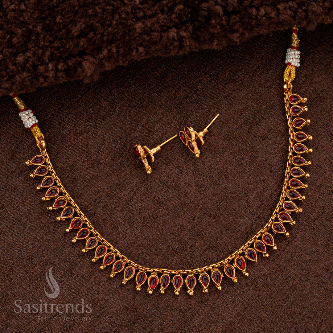 Classic matte gold necklace with ruby stones and golden ball accents - Sasitrends