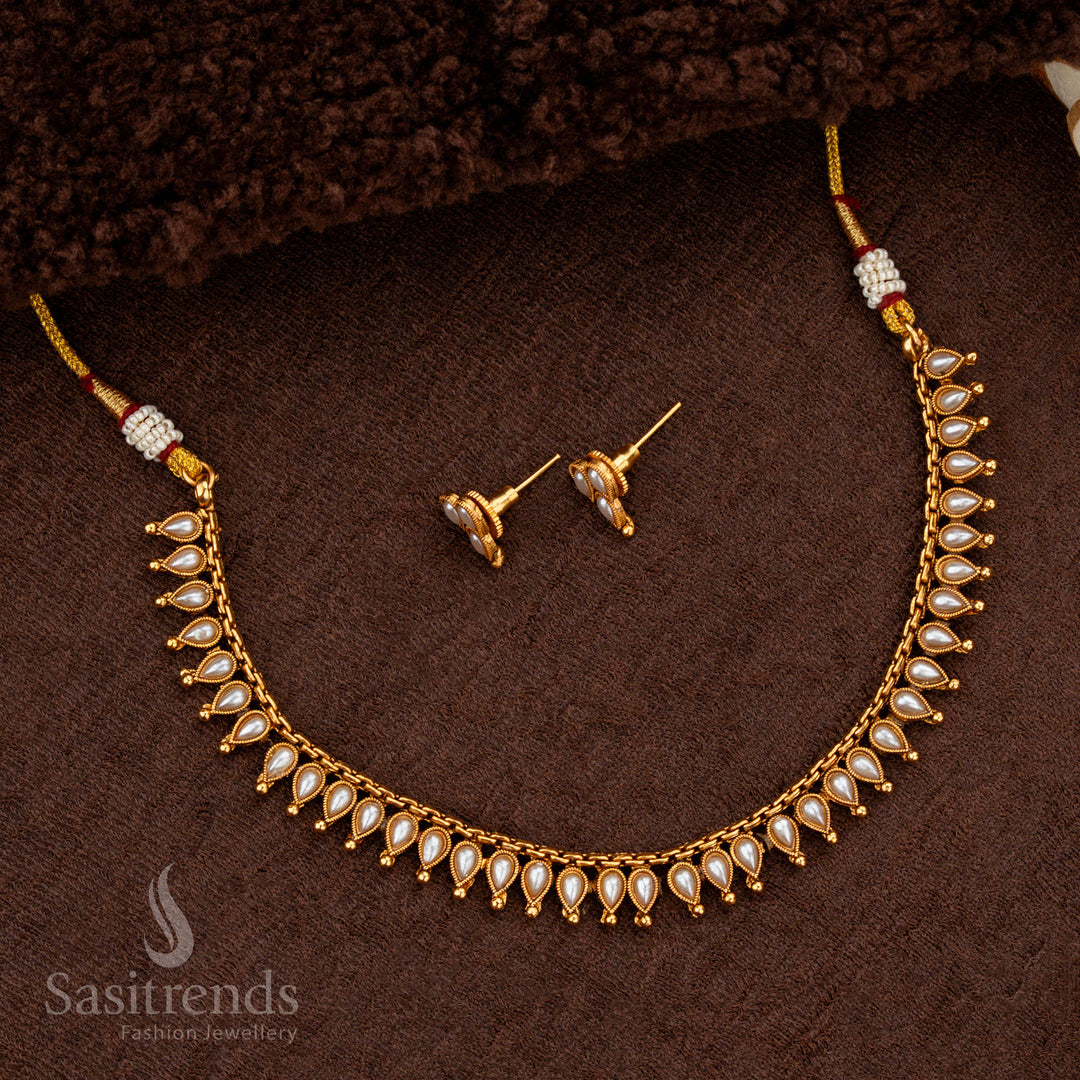 Classic matte gold necklace with white stones and golden ball accents - Sasitrends