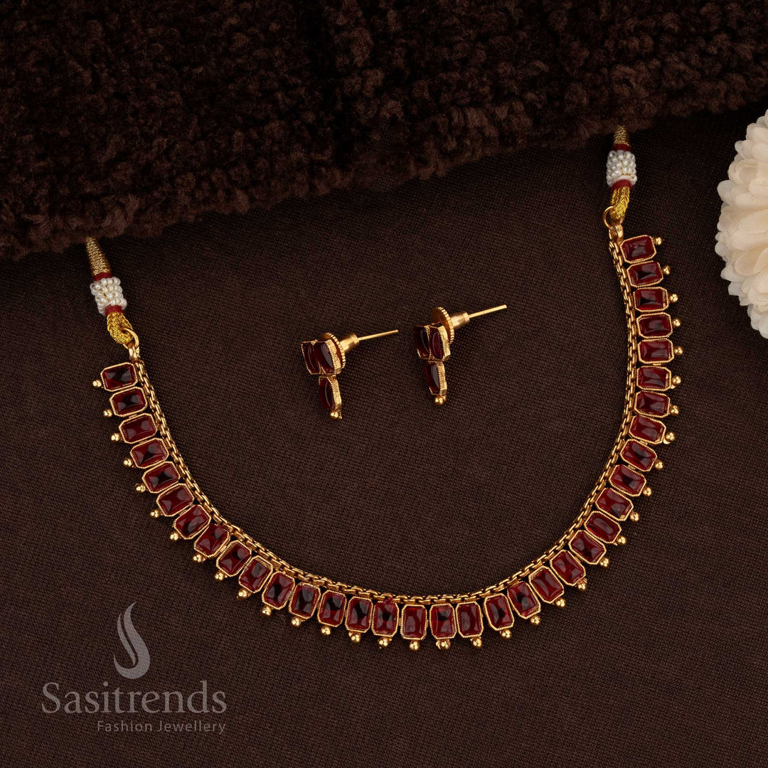 Gorgeous Classic Matte Gold Necklace Jewellery Set Adorned With Rectangular Kemp Stones In Ruby Colour, Featuring Matte Gold Plating, Artistic Detailing, And A Grand Finish Ideal For Bridal And Party Wear Styling – Sasitrends