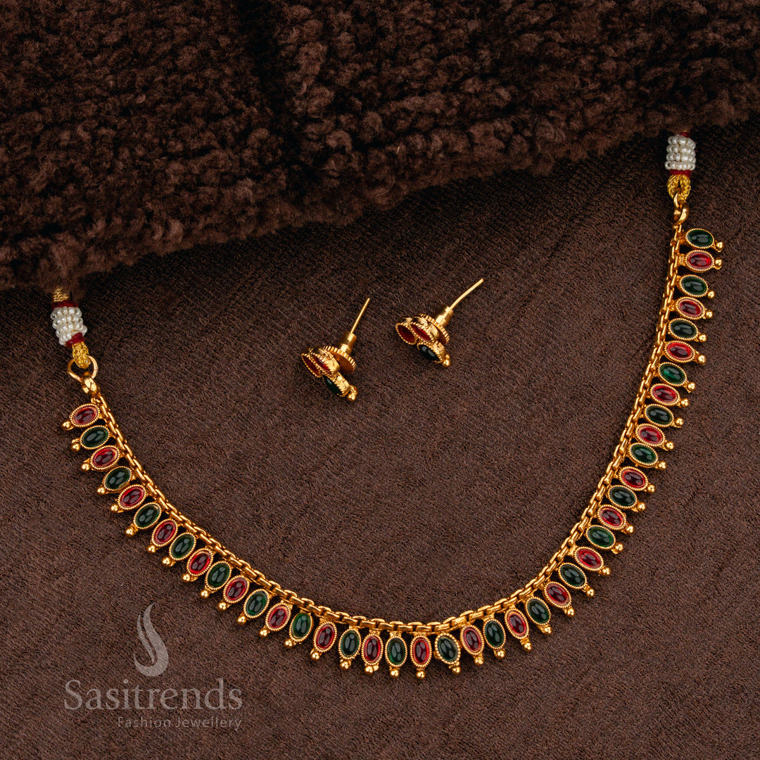 Luxurious ruby-green stone matte gold plated necklace set, featuring an ornate handcrafted finish, making it a regal choice for bridal jewellery - Sasitrends