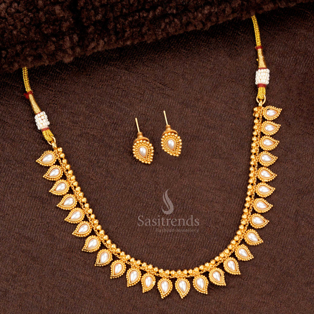 Traditional necklace set with pearl teardrop motifs and matching earrings, perfect for weddings and festive occasions - Sasitrends