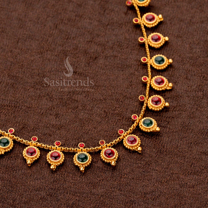 Heritage-inspired temple necklace set in matte gold, boasting finely sculpted round droplet ornaments and a classic arrangement of ruby-green gemstones - Sasitrends