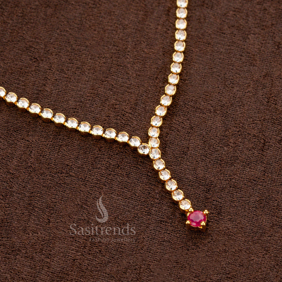 Stunning and traditional designer necklace crafted with an intricate mix of white and ruby American Diamond round stones, set in micro gold finish for a grand festive touch - Sasitrends