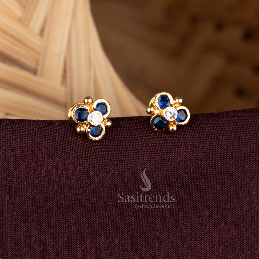 Gold look floral design stud earrings with AD stones by Sasitrends