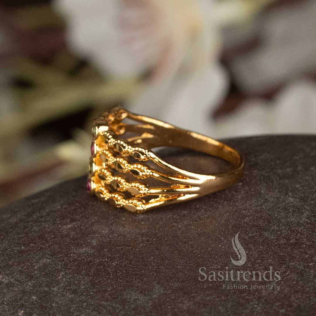 AD stone embellished micro plated gold ring in a step pattern.