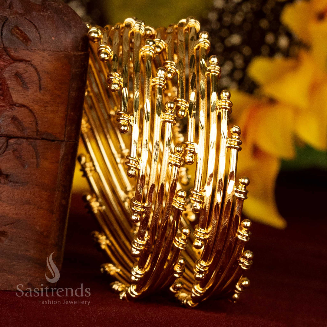 Ornate gold-plated bangles for women, featuring a distinctive multi-row textured design, perfect for festive occasions - Sasitrends