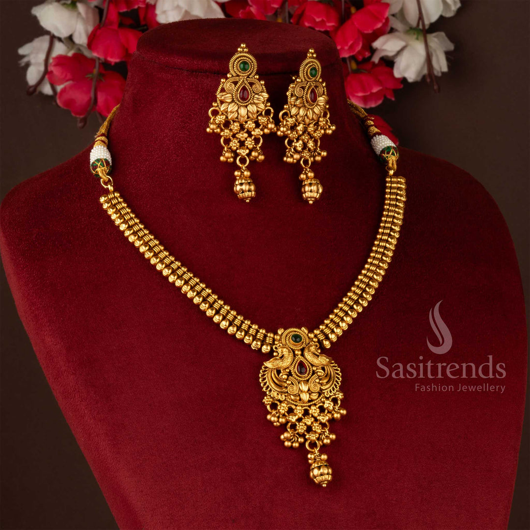 Antique gold-plated peacock and floral brass jewellery set with earrings, perfect for traditional events