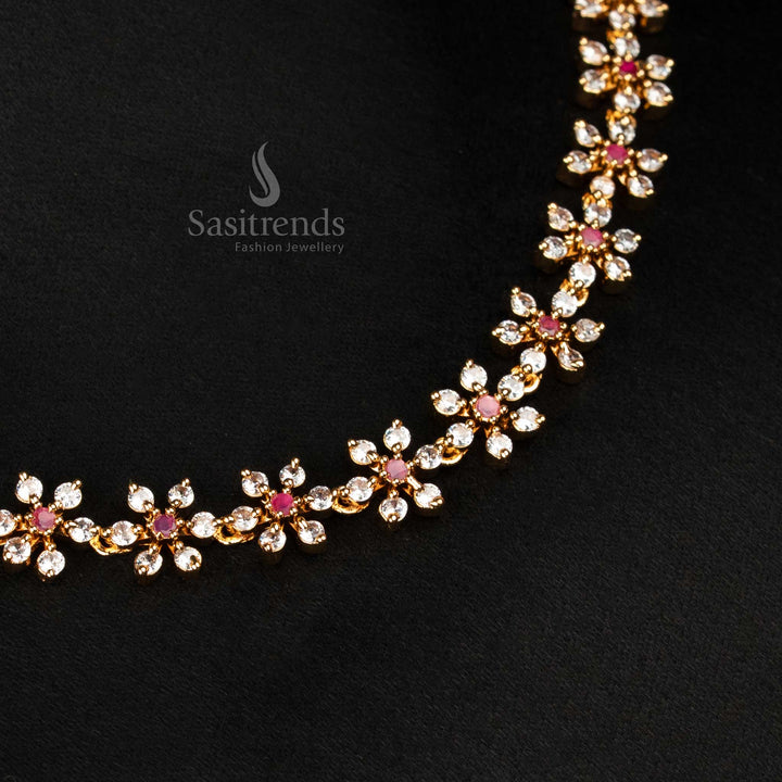 Traditional white and ruby micro gold plated floral necklace embedded with lustrous American diamond stones and jewelled matching earrings – festive sparkle for saree lovers – Sasitrends