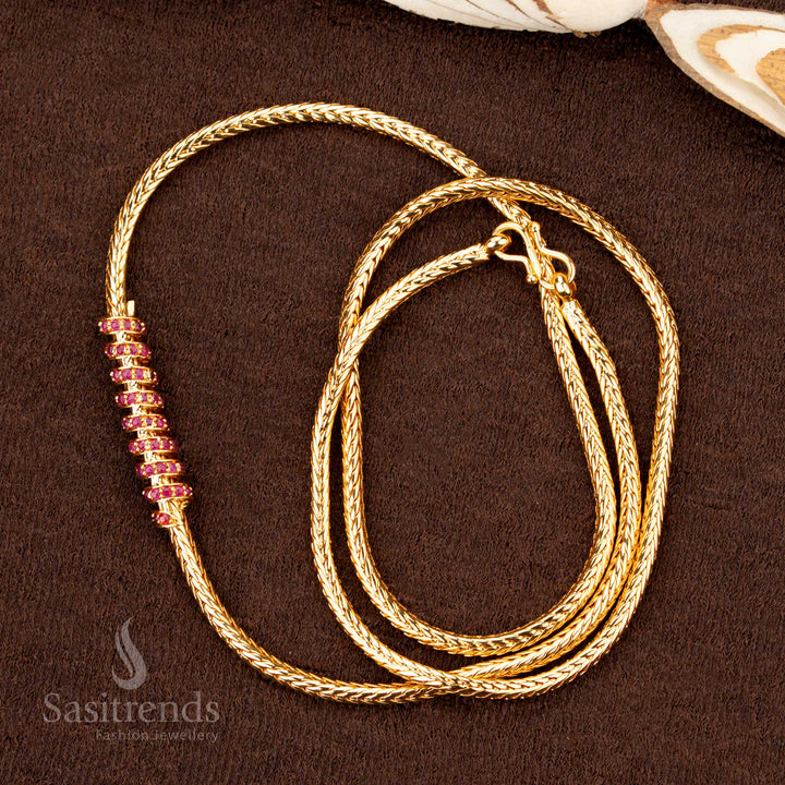 A premium one-gram gold plated spiral spring design mugappu chain featuring glittering ruby-crimson AD stones, an ethnic jewellery masterpiece for a graceful and festive look - Sasitrends