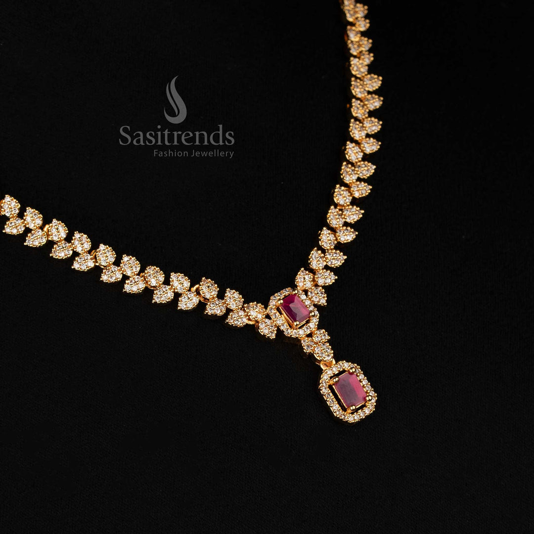 Graceful white-ruby American diamond-studded leaf pattern necklace with micro gold finish and striking rectangular pendant – a radiant traditional jewellery set – Sasitrends