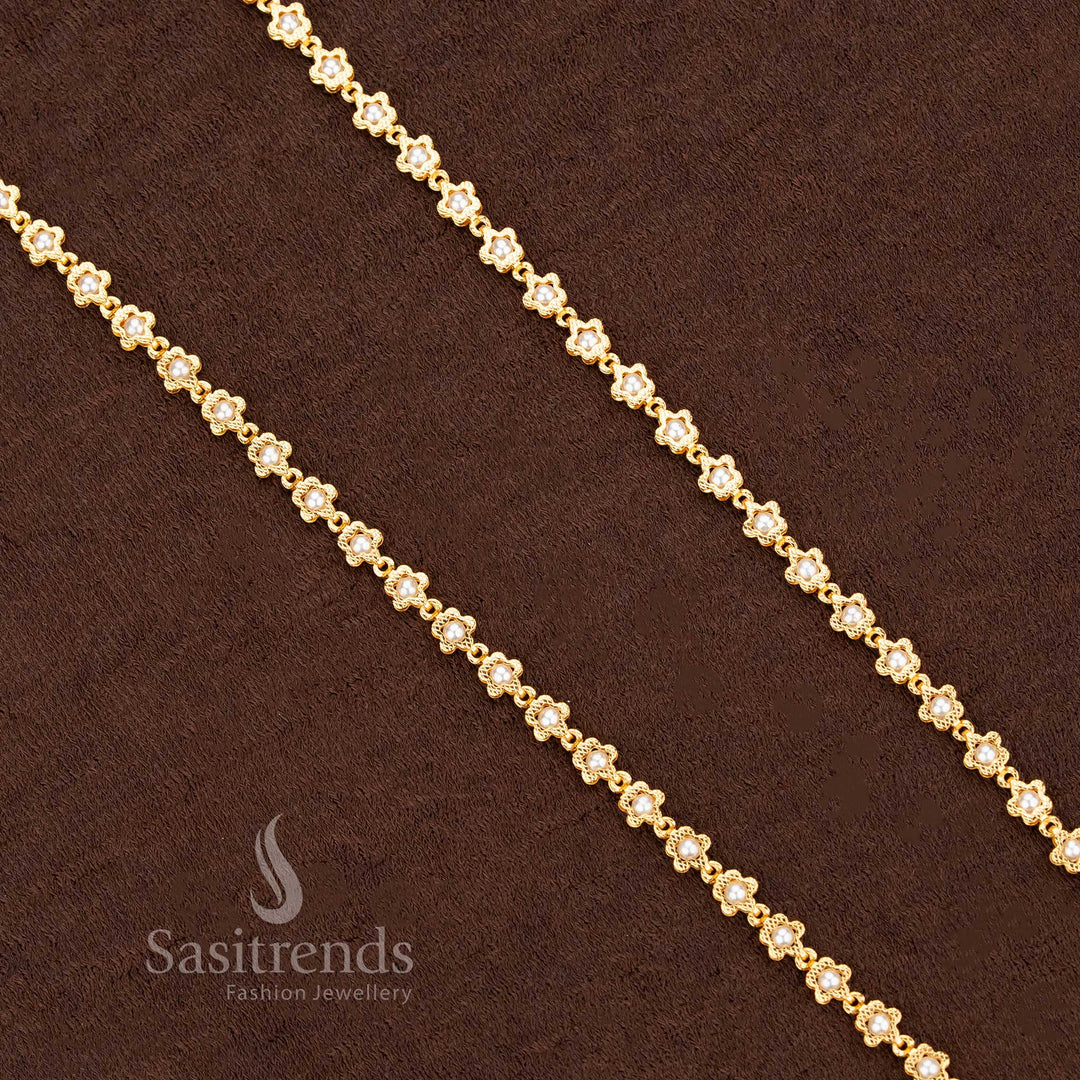 Elegant pearl-beaded chain with micro gold plated floral links, radiating a 24-carat gold look. This festive necklace is adorned with soft ivory pearls, perfect for traditional saree jewellery styling – Sasitrends