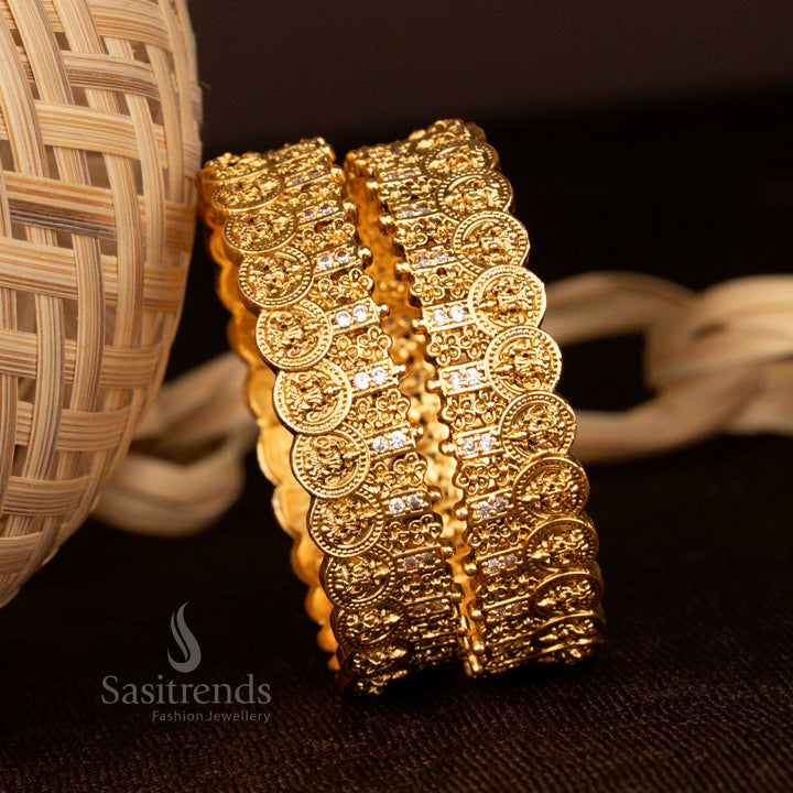 Imperial matte gold Lakshmi coin floral bangles designed with pearlescent white glow stones for a heritage bridal look - Sasitrends
