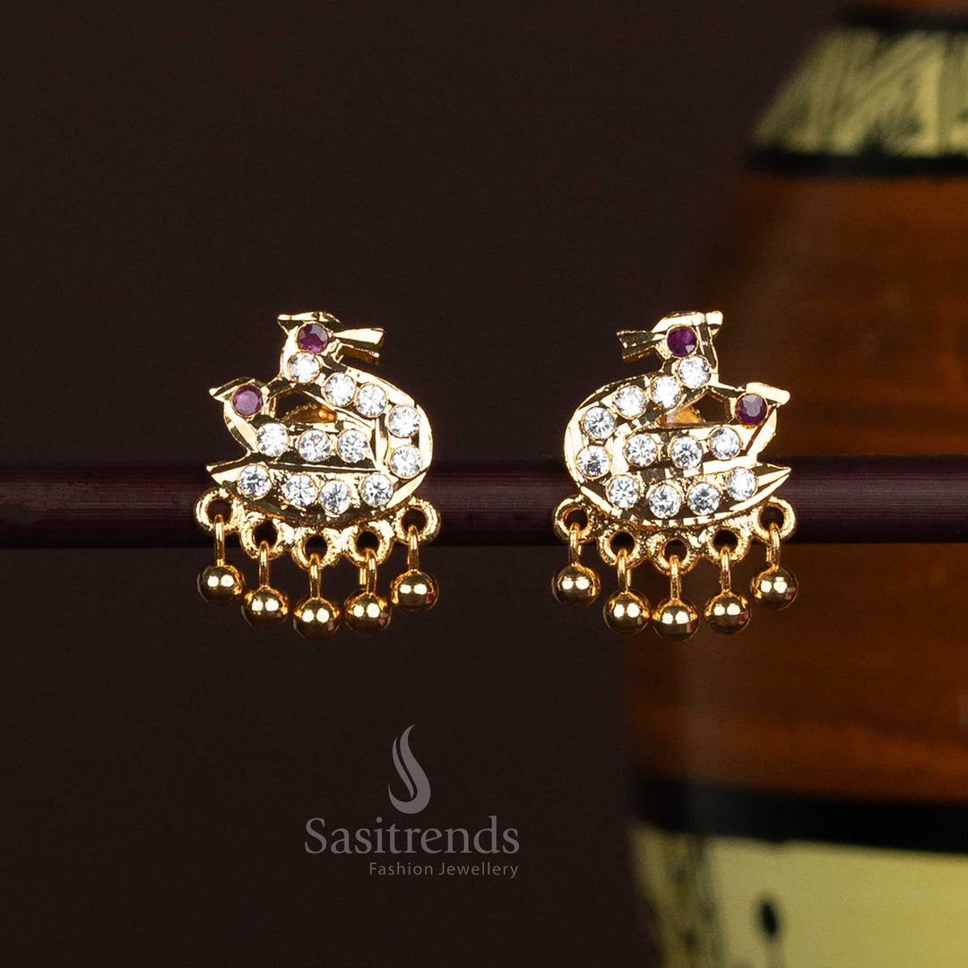 Exquisite Addigai earrings featuring swan designs in a glowing micro gold finish with delicately suspended drops – a fine traditional accessory suited for temple visits, classical dance wear, and cultural gatherings – Sasitrends