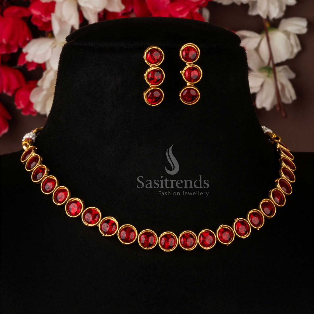 Classic matte gold antique choker necklace jewellery set adorned with deep ruby stones and matching earrings, exuding royal charm and timeless elegance – perfect for festive and wedding ensembles – Sasitrends