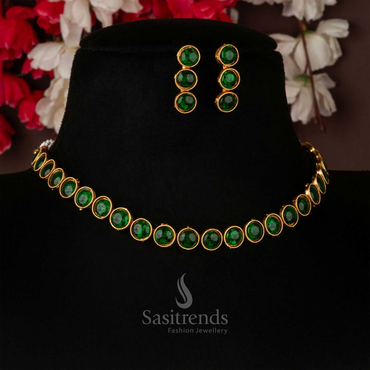 Vibrant classic matte gold antique choker necklace jewellery set adorned with emerald green stones and matching earrings, enhancing ethnic outfits with a fresh and lively touch – Sasitrends