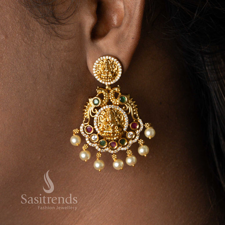 Traditional Temple Matte Gold Plated Lakshmi Pendant Earrings Jewellery Set with Pearl Droppings and Round Lakshmi Coins – Gorgeous Bridal Jewellery Worn by Model - Sasitrends