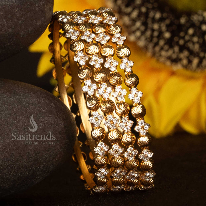 Graceful spiral bangles with shimmering white stones and micro gold plated finesse – designed in a traditional style with a bright one gram finish, elegant jewellery that mimics real gold – Sasitrends